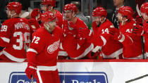 Detroit Red Wings left wing Andreas Athanasiou (72) is congratulated for his goal against the Montreal Canadiens during the third period of an NHL hockey game Tuesday, Feb. 18, 2020, in Detroit. (AP Photo/Paul Sancya)