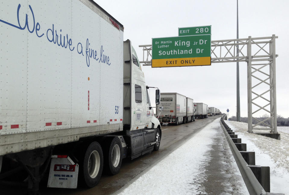 Traffic, stalled on icy eastbound Interstate 40 heading towards Tennessee, approaches a bridge over the Mississippi River in West Memphis, Ark., Tuesday, March 4, 2014. Some motorists on the highway in eastern Arkansas were stranded overnight due to lingering icy conditions from a weekend winter storm. An Arkansas highway department spokesman said Tuesday that traffic can't get moving consistently because of repeated accidents.(AP Photo/Adrian Sainz)