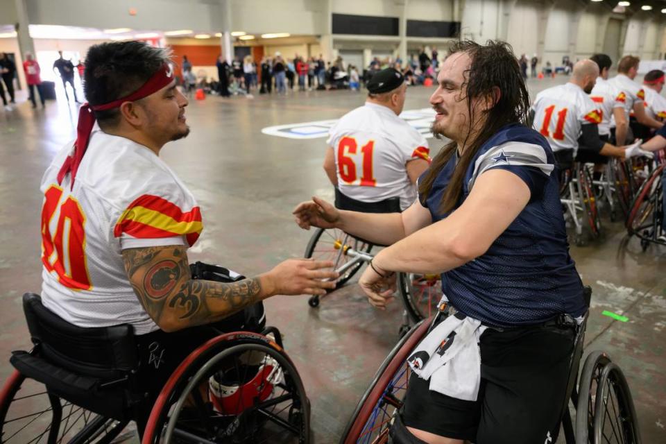 Kansas City Chiefs player Alex Nguyen, left, congratulates Dallas Cowboys player Zach Blair, right, after the Cowboys defeated the Chiefs for the USA Wheelchair Football League Championship, a program of Move United, Tuesday, Feb. 6, 2024 in Dallas, Texas.