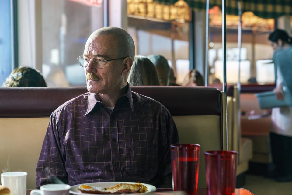 walter sititng in a diner booth not touching his food