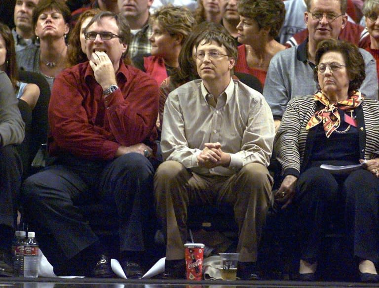 Microsoft co-founders Allen, left and Bill Gates watch the third game of the Western Conference Finals between the Los Angeles Lakers and the Portland Trail Blazers in Portland, Oregon on May 26, 2000
