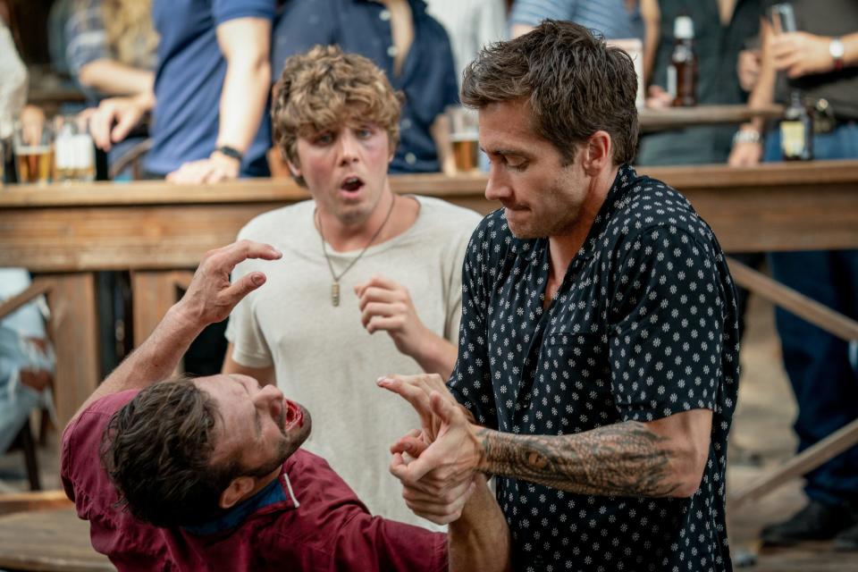 Dalton (Jake Gyllenhaal, far right) shows Billy (Lukas Gage) how to deal with an unpleasant patron in the new "Road House."