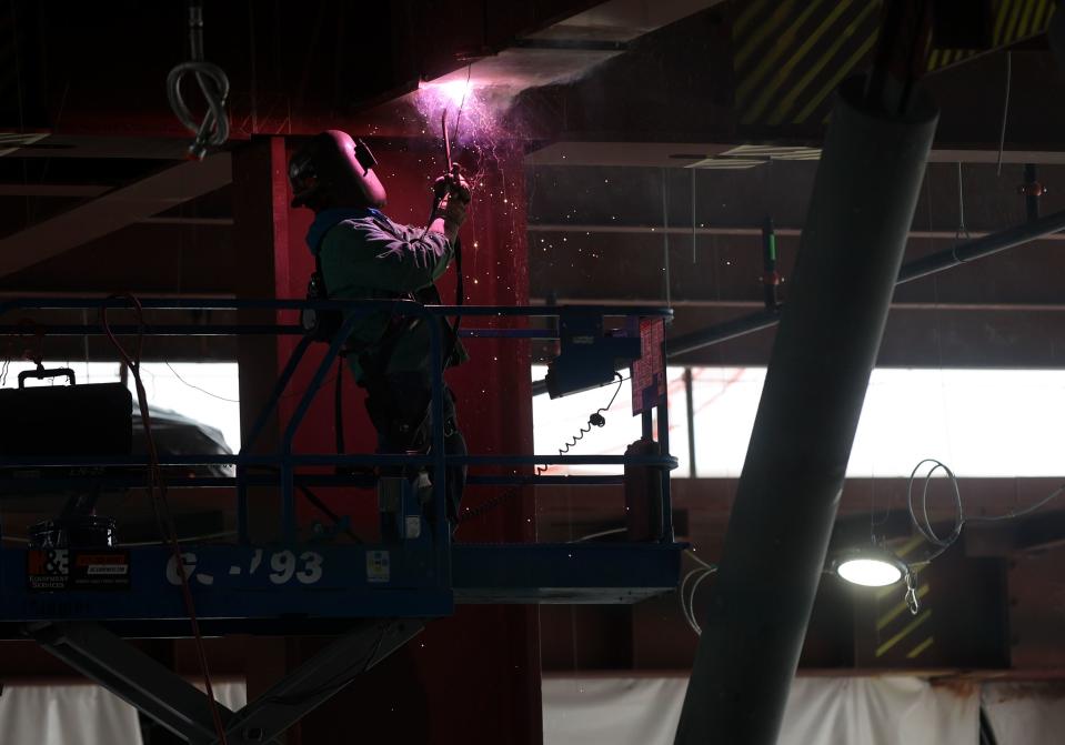 A construction worker welds as phase three of the Salt Lake City International Airport construction continues in Concourse B in Salt Lake City on Tuesday, June 20, 2023. | Kristin Murphy, Deseret News