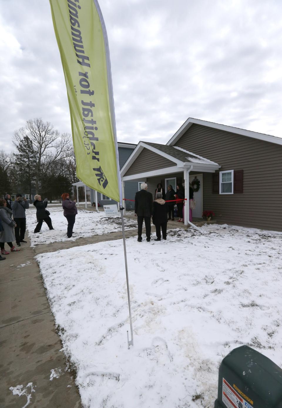 A ceremony for the latest new homeowner to move into a house built by Habitat for Humanity of St. Joseph County takes place Wednesday, Dec. 20, 2023, on Yearwood Lane in Mishawaka. Ryan Durham received the keys to her new house, one of 12 that were built in 2023, according to Habitat officials.