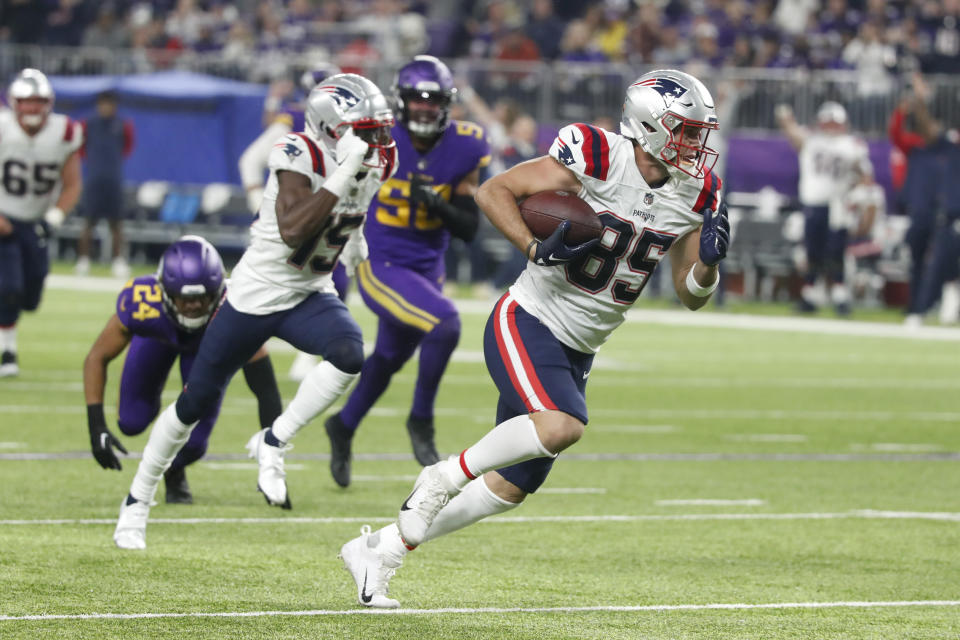 New England Patriots tight end Hunter Henry (85) runs up field during a 37-yard touchdown reception in the second half of an NFL football game against the Minnesota Vikings, Thursday, Nov. 24, 2022, in Minneapolis. (AP Photo/Bruce Kluckhohn)