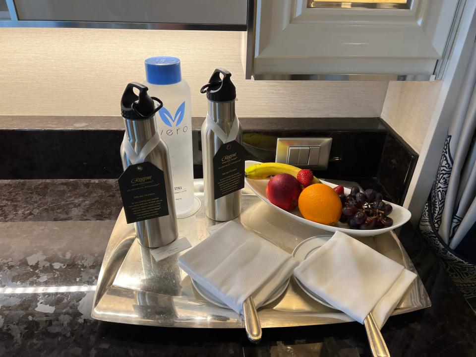 fruit and water bottles on a tray