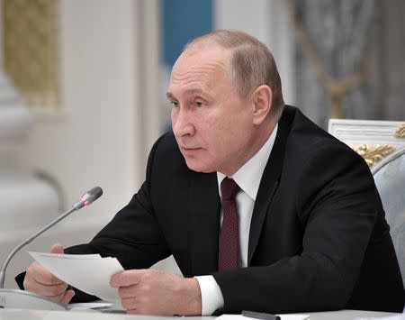 FILE PHOTO: Russian President Vladimir Putin speaks at the meeting to discuss preparations to mark the anniversary of the allied victory in the World War II at the Kremlin in Moscow, Russia December 12, 2018. Sputnik/Aleksey Nikolskyi/Kremlin via REUTERS