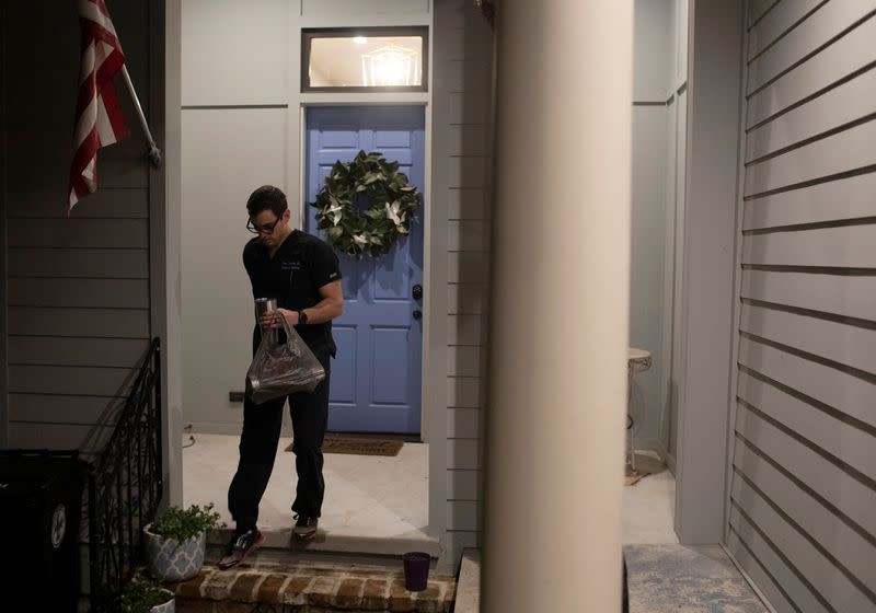 Emergency medicine physician Krajewski leaves his home for start of his shift in New Orleans