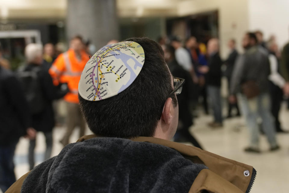 A man wears a kippah displaying a map of the New York City subways after the inaugural ride of a new Long Island Railroad route into Grand Central Station in New York, Wednesday, Jan. 25, 2023. After years of delays and massive cost overruns, one of the world's most expensive railway projects on Wednesday began shuttling its first passengers between Long Island to a new annex to New York City's iconic Grand Central Terminal. (AP Photo/Seth Wenig)