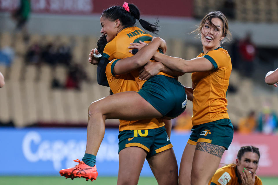 Seen here, Australia's Faith Nathan celebrates scoring the winning try in the Seville Sevens final.