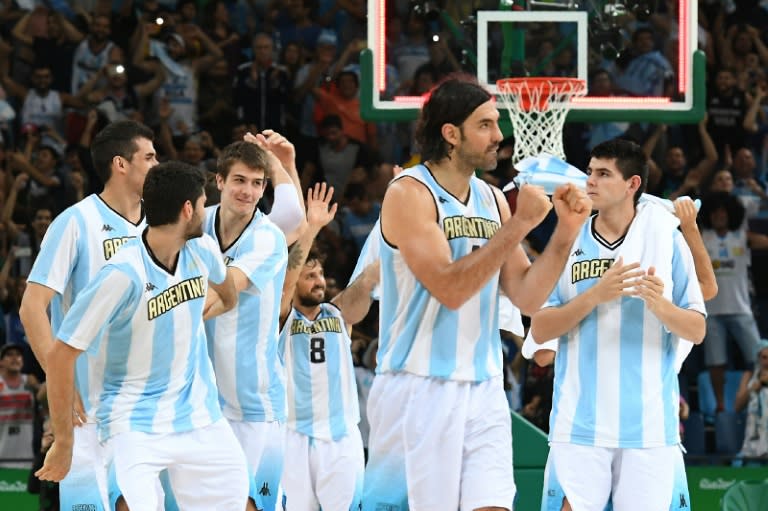 Argentina's power forward Luis Scola (2nd R) and teammates celebrate after defeating Croatia during a men's basketball match in Rio on August 9, 2016