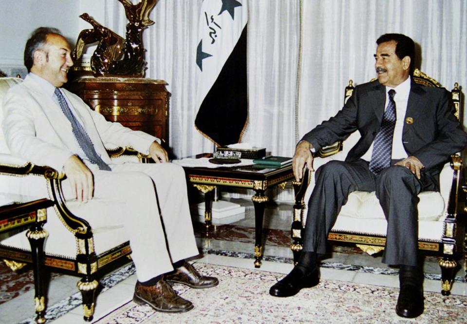 Galloway sits with Saddam Hussein in a meeting with the Iraqi dictator condemned by many in the West (INA/AFP via Getty)