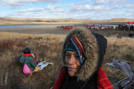 Dolores Moreno sits on the sidelines during a protest against plans to pass the Dakota Access pipeline near the Standing Rock Indian Reservation, near Cannon Ball, North Dakota, U.S. November 18, 2016. REUTERS/Stephanie Keith