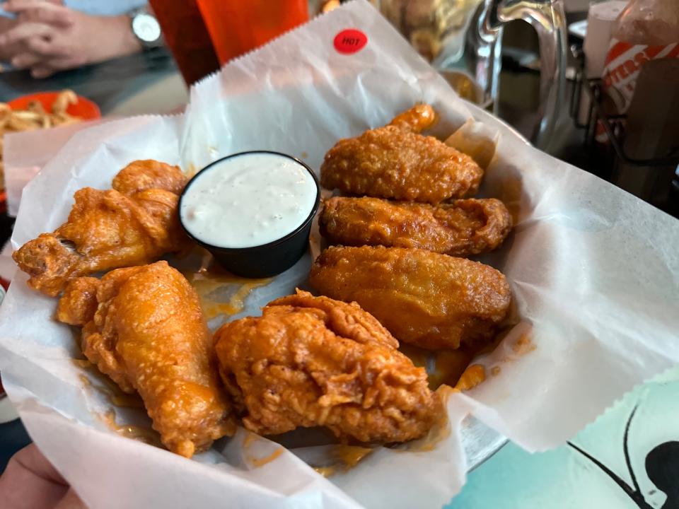 Hooters breaded wings in basket 