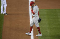 Philadelphia Phillies relief pitcher David Phelps walks toward the dugout after he was pulled during the third inning of the second baseball game of the team's doubleheader against the Washington Nationals, Tuesday, Sept. 22, 2020, in Washington. This game is a makeup from Aug. 27. (AP Photo/Nick Wass)