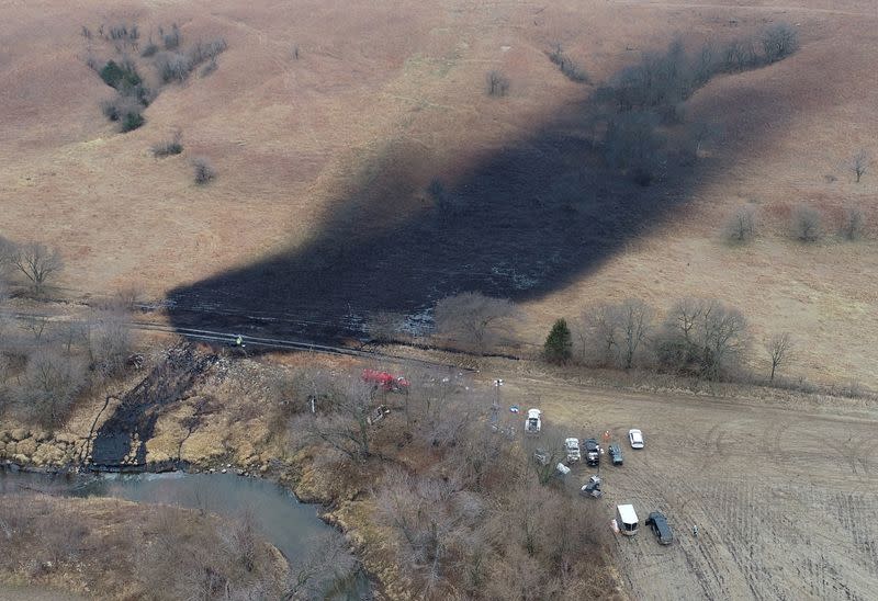 FILE PHOTO: Investigators, cleanup crews begin scouring oil pipeline spill in Kansas