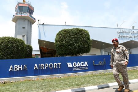 A Saudi security officer walks past the Saudi Arabia's Abha airport, after it was attacked by Yemen's Houthi group in Abha