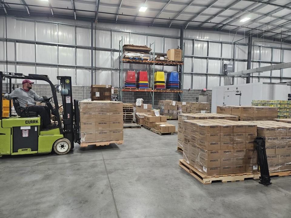 Workers at the York County Food Bank's warehouse in Manchester Township unload a tractor-trailer of food donated by the Church of Jesus Christ of Latter-day Saints. The donation of more than 28,000 pounds of food was the first from the church, and may not be the last.