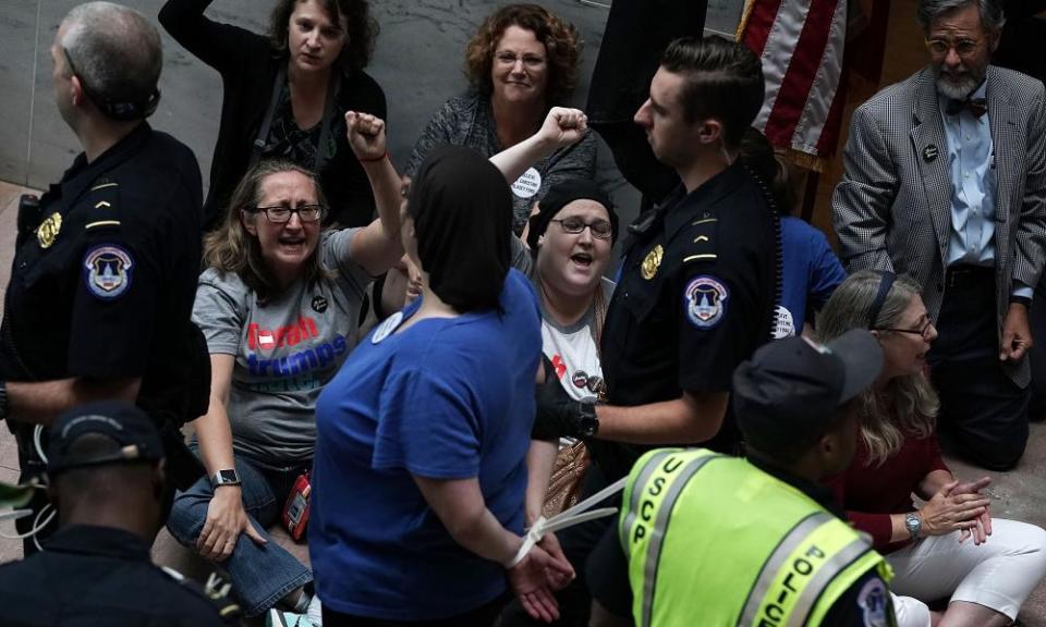 Activists chant slogans during a protest outside the office of the Senate judiciary committee chairman Chuck Grassley.