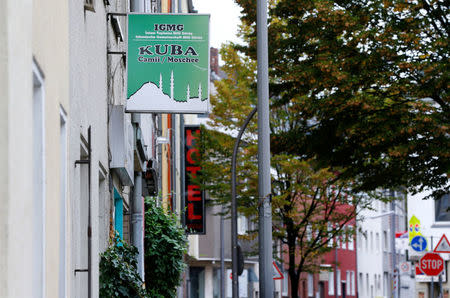 A view shows the Turkish Kuba Camii mosque near a hotel (in rear) housing refugees in Cologne's district of Kalk, Germany, October 14, 2016. REUTERS/Wolfgang Rattay