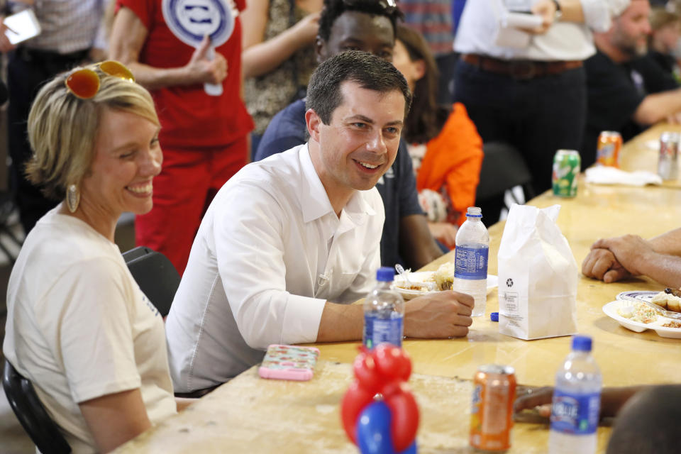 Democratic presidential candidate Pete Buttigieg speaks with local residents at the Hawkeye Area Labor Council Labor Day Picnic, Monday, Sept. 2, 2019, in Cedar Rapids, Iowa. (AP Photo/Charlie Neibergall)