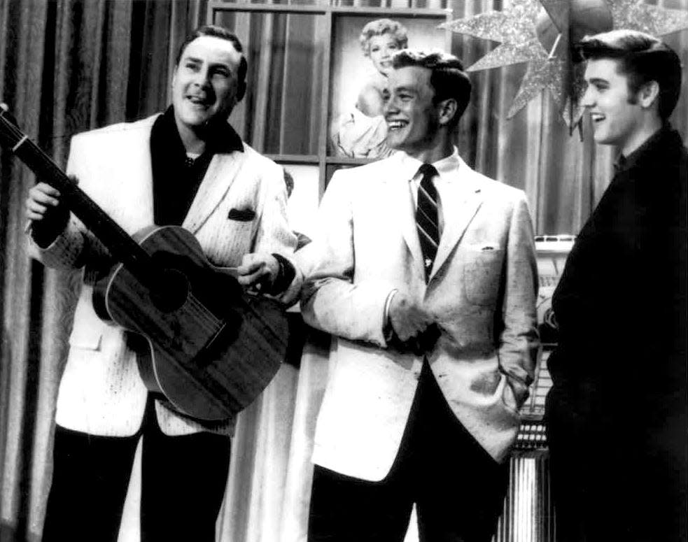 Elvis Presley visits the set of "Dance Party" with Wink Martindale, center, and Dewey Phillips in 1956. Phillips was the first deejay to play Elvis' first recording, "That's All Right."
