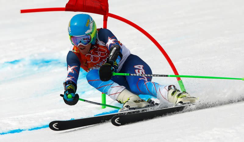 FILE PHOTO: Ligety of the U.S. clears a gate during the first run of the men's alpine skiing giant slalom event at the 2014 Sochi Winter Olympics