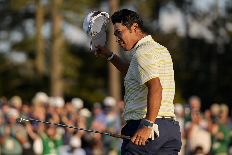 Hideki Matsuyama, of Japan, tips his cap after winning the Masters golf tournament on Sunday, April 11, 2021, in Augusta, Ga. (AP Photo/Matt Slocum)