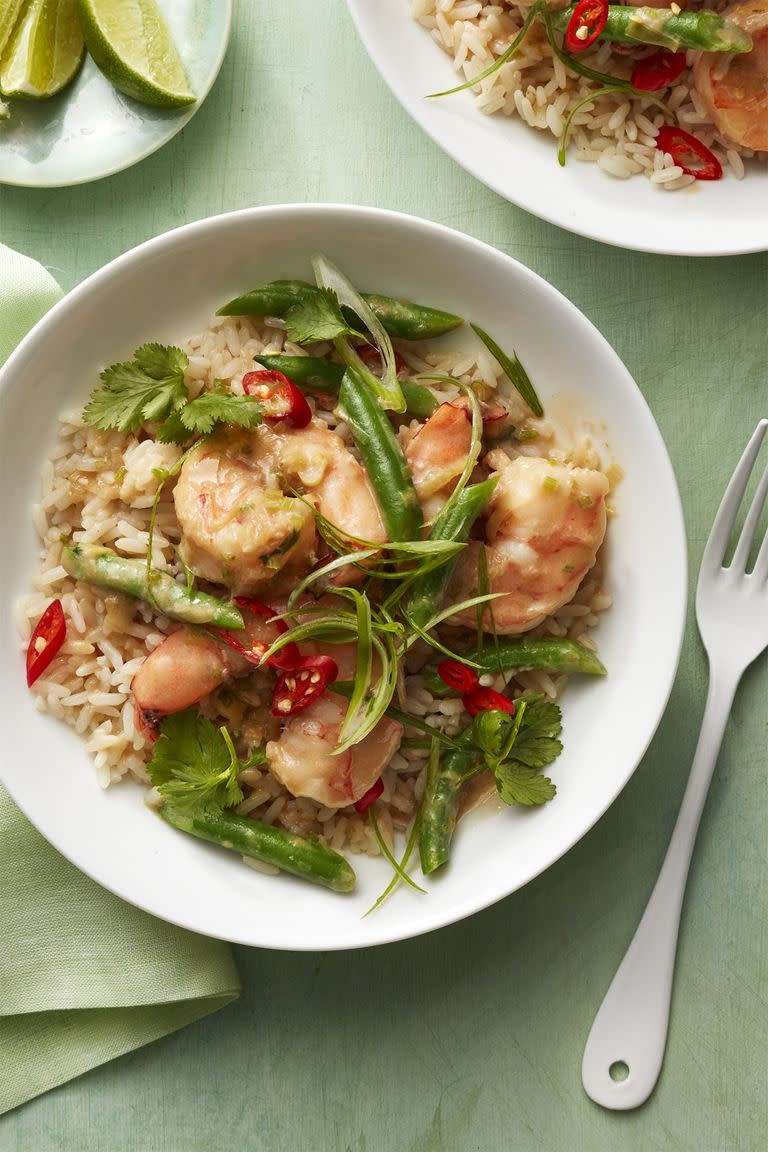 <p> Take a temporary trip to the islands with spicy coconut shrimp dish. Pro tip: to make sure your rice doesn't get clumpy when cooking, rinse the grains under cold water before cooking.</p><p><a href="https://www.womansday.com/food-recipes/food-drinks/recipes/a58518/coconut-shrimp-rice-recipe/" rel="nofollow noopener" target="_blank" data-ylk="slk:Get the Coconut Shrimp and Rice recipe.;elm:context_link;itc:0;sec:content-canvas" class="link "><em>Get the Coconut Shrimp and Rice recipe.</em></a></p>