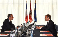 Austrian chancellor Christian Kern (L) and French President Emmanuel Macron attend a meeting at the Congress palace in Salzburg, Austria, August 23, 2017. REUTERS/Bertrand Guay/Pool