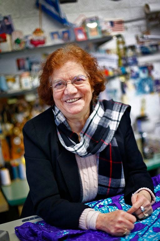 In this 2017 photo, Angie Spiropoulos, then 79, is at her Quincy Taylor Shop on Washington Street in the Quincy Point neighborhood. She opened the shop in 1982 and still works three days a week..