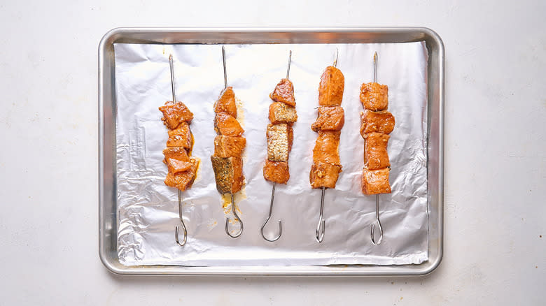 salmon skewers on sheet tray