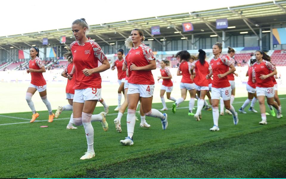 LEIGH, ENGLAND - JULY 09: Switzerland players warm up prior to the UEFA Women's Euro 2022 group C match between Portugal and Switzerland at Leigh Sports Village on July 09, 2022 in Leigh, England - Harriet Lander/Getty Images