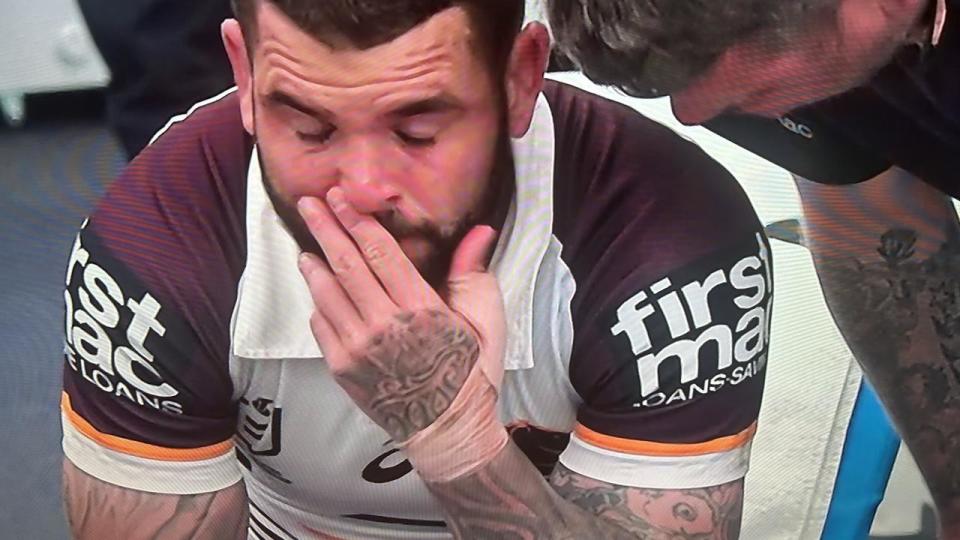 Broncos skipper Adam Reynolds in tears at halftime of the match against the Storm after succumbing to a knee injury.
