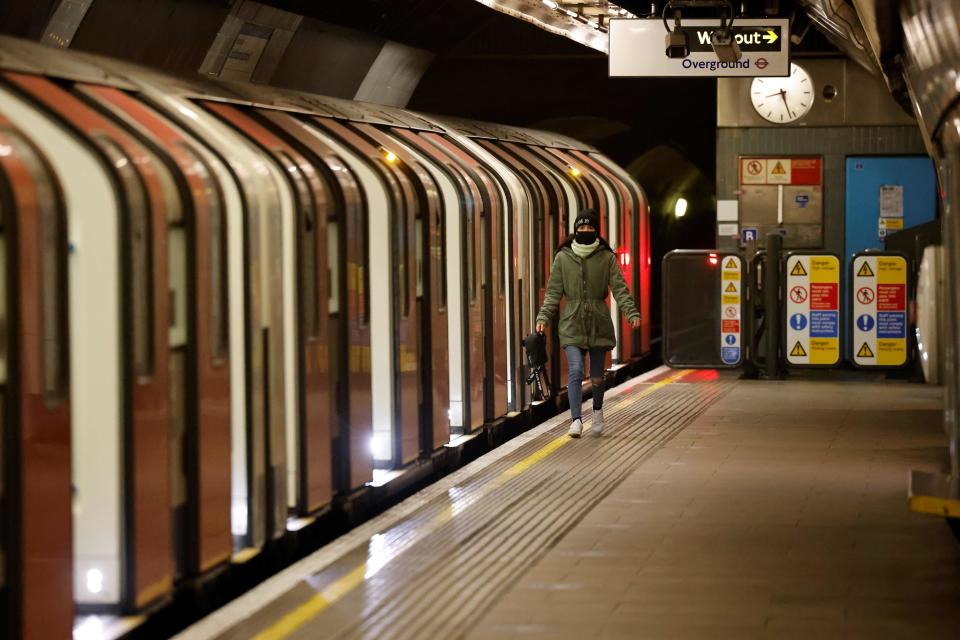Commuters travel on the London underground as Britain enters a national lockdown in London on Jan. 5, 2021.