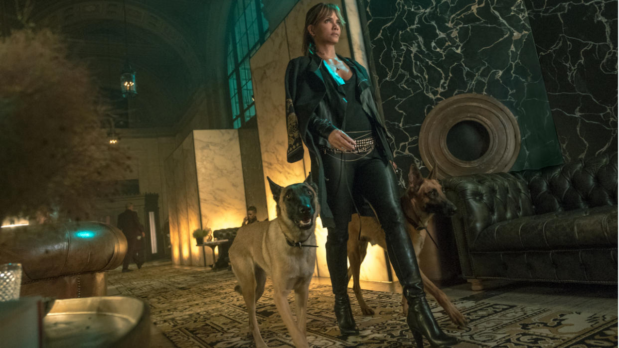  Halle Berry walking in the lobby with two Belgian Malinois in John Wick: Chapter 3 - Parabellum. 