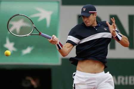 Tennis - French Open - Roland Garros - John Isner of the U.S. v Andy Murray of Britain - Paris, France - 29/05/16. John Isner returns the ball. REUTERS/Pascal Rossignol