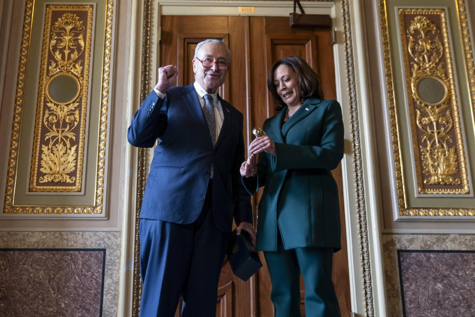 Senate Majority Leader Sen. Chuck Schumer, D-N.Y., presents Vice President Kamala Harris with a golden gavel after she cast the 32nd tie-breaking vote in the Senate, the most ever cast by a vice president, Tuesday, Dec. 5, 2023, on Capitol Hill in Washington. (AP Photo/Stephanie Scarbrough)