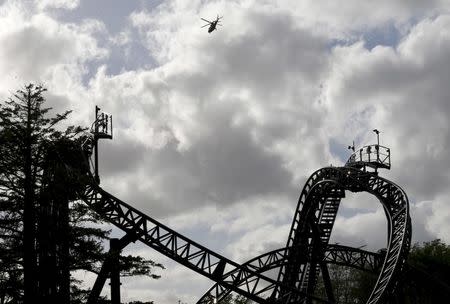 An air ambulance flies over the Smiler ride at Alton Towers in Alton, Britain June 2, 2015. REUTERS/Darren Staples