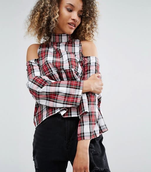 <p><a rel="nofollow noopener" href="http://www.asos.com/milk-it/milk-it-vintage-high-neck-top-with-frill-hem-and-cold-shoulder-in-tartan/prd/7111688?iid=7111688&clr=Blacktartan&SearchQuery=tartan&pgesize=53&pge=0&totalstyles=53&gridsize=3&gridrow=7&gridcolumn=3" target="_blank" data-ylk="slk:ASOS, £32;elm:context_link;itc:0;sec:content-canvas" class="link "><i>ASOS, £32</i></a> </p>