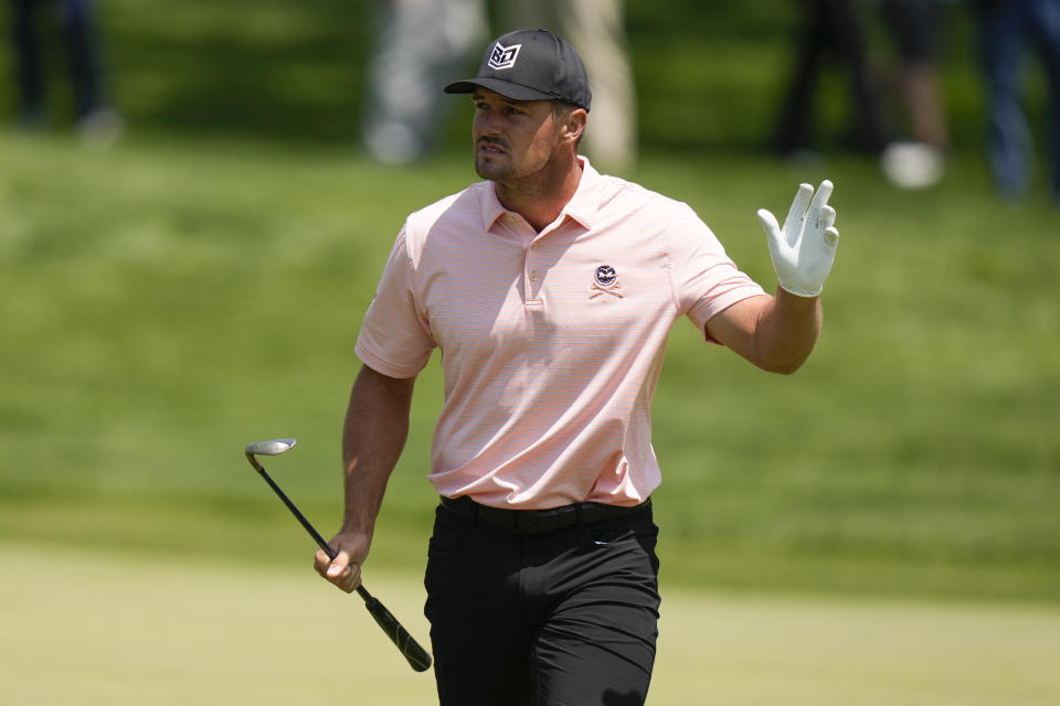 Bryson DeChambeau waves after his chip on the 16th hole during the first round of the PGA Championship golf tournament at Oak Hill Country Club on Thursday, May 18, 2023, in Pittsford, N.Y. (AP Photo/Seth Wenig)