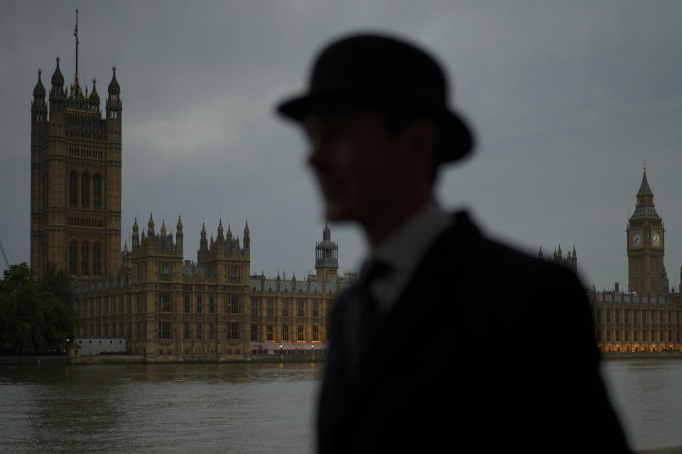 Alex Gerald from London arrives with the queue opposite of Westminster Palace to pay his respect to late Queen Elizabeth II who's lying in state at Westminster Hall in London, Thursday, Sept. 15, 2022. The Queen will lie in state in Westminster Hall for four full days before her funeral on Monday Sept. 19.(AP Photo/Markus Schreiber)