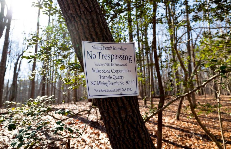 A sign put up by Wake Stone Corp. shows the boundary between William B. Umstead State Park and land owned by Raleigh-Durham International Airport where the company plans to build a quarry. The Umstead Coalition says it has found evidence that the boundary is off by more than 120 feet.