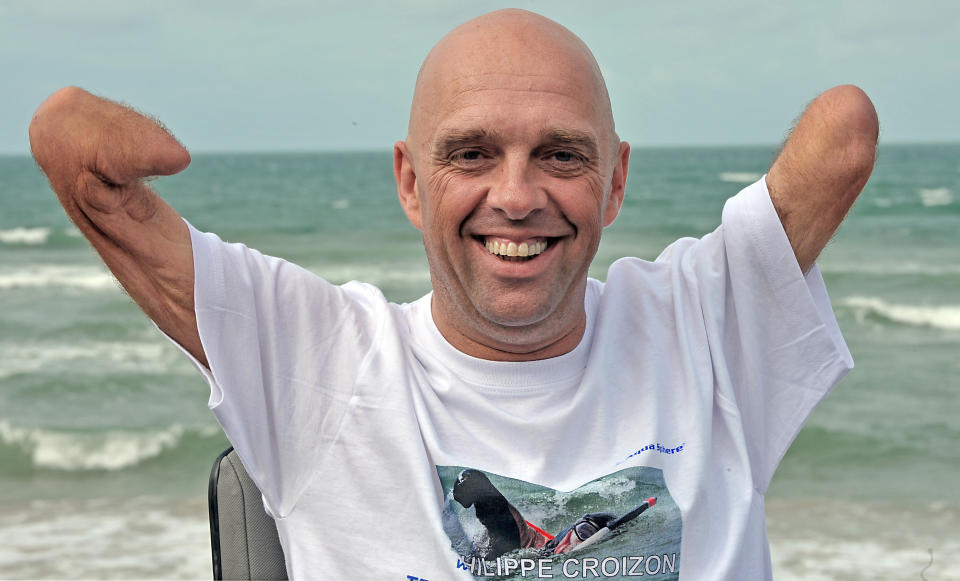 TO GO WITH AFP STORY by Patrick Filleux(FILES) A file picture taken on September 20, 2010 shows French amputee and swimmer Philippe Croizon posing in Wissant, northern France after he succeeded on September 18 his attempt to swim the English Channel, a challenge he has been preparing for two years. A Frenchman who gained fame for swimming the English Channel with no arms or legs has set himself a new challenge: to cross five continents in waters marked by sharks, poisonous jellyfish, icy currents and cargo ships. Philippe Croizon, 43, who lost both his arms and legs in an electrical accident 17 years ago, has begun preparing, on May 2011, one year ahead to swim hundreds of kilometres in waters connecting five continents from May to August. AFP PHOTO / PHILIPPE HUGUEN (Photo credit should read PHILIPPE HUGUEN/AFP/Getty Images)