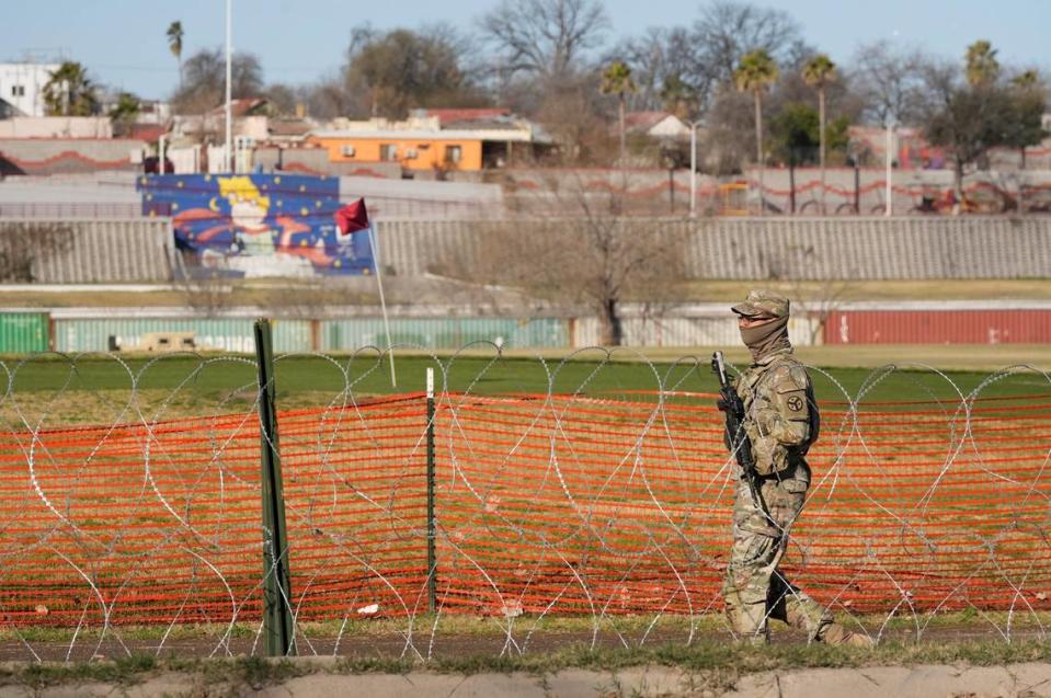 A National Guard soldier guards Shelby Park in Eagle Pass on Feb. 4. A new Texas law Texas state law makes it a misdemeanor to cross the international border without authorization.