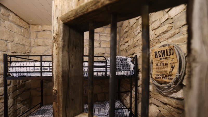 Two jail cells, turned into a bedroom and bathroom, await guests at a historic jail and city hall that was converted into an Airbnb in Ephraim, Monday, March 11, 2024.