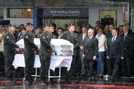 Brazilian President Michel Temer receives the coffin of Chapecoense player Thiaguinho who died in the plane crash in Colombia, in Chapeco, Brazil December 3, 2016. REUTERS/Paulo Whitaker