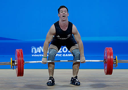 Cameron Mctaggart of New Zealand competes in the Men's 69kg Weightlifting on day three of the Nanjing 2014 Summer Youth Olympic Games.