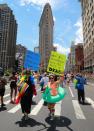 <p>Marchers hold up signs during the N.Y.C. Pride Parade in New York on June 25, 2017. (Photo: Gordon Donovan/Yahoo News) </p>