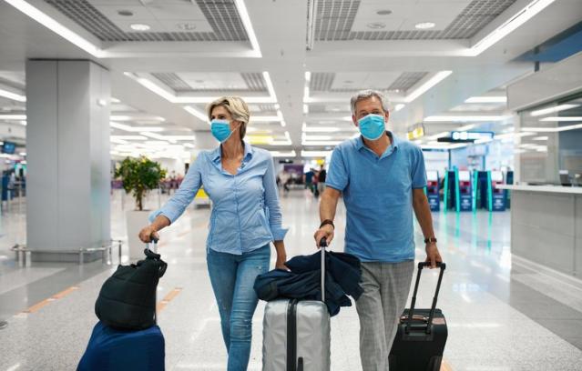 Shopper Wearing Face Mask Walks Past Editorial Stock Photo - Stock